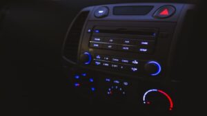 A view of a car dashboard, with its many knobs and dials for tuning into the radio